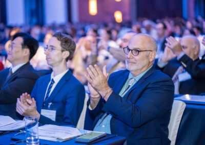 Attendees clapping during the Global Peace Convention 2023 Main Plenary