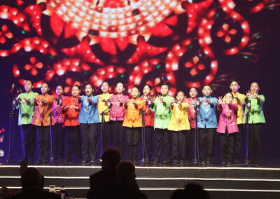 A group of people standing on stage at an Awards Gala or Global Peace Convention.