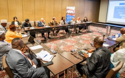 A religious freedom roundtable: A gathering of individuals, assembled in a conference room, engaging in discussions around a table.