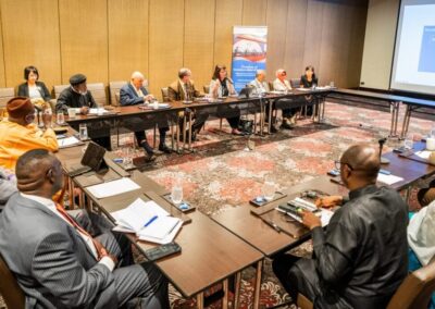 A religious freedom roundtable: A gathering of individuals, assembled in a conference room, engaging in discussions around a table.